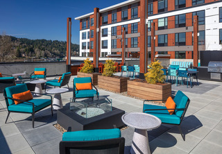 Axletree outdoor terrace with seating, BBQ, and river views