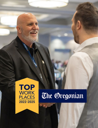 Team members smiling and Top Workplaces Logo