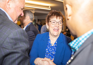 Tootie Smith speaking with others