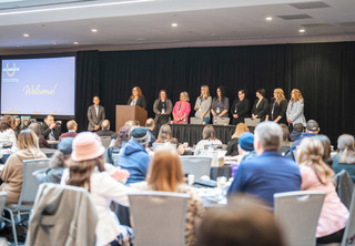 Portfolio Management team on stage in front of crowd