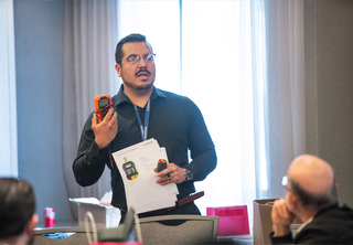 Man presenting GFCI tester to the room