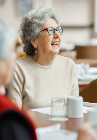 Woman smiling at an independent living facility