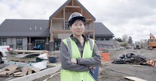 Xiaofei Ren in front of Seven Acres