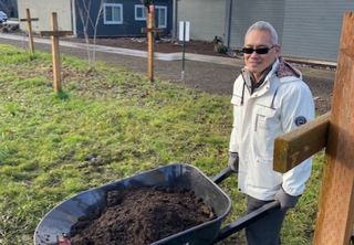 Fairhaven Gardens Clean-up Worker with wheelbarrow
