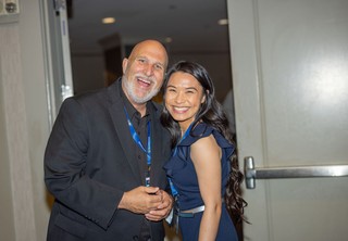 Two professionals posing for photo