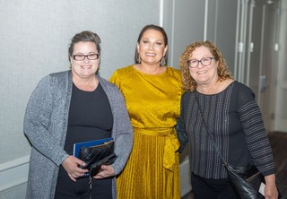 Three professionals posing for photo
