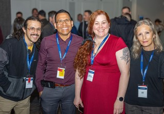 Group of professionals smiling for camera