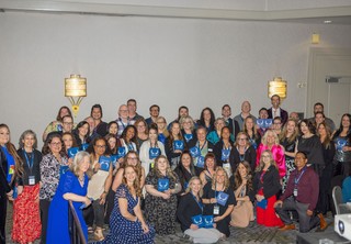 Large group of award winners gathered for group photo