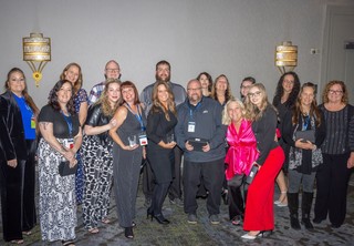 Group of award winners posing for photo