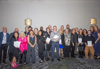 Group of award winners posing for photo