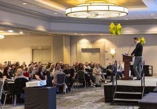 President of company addressing the room