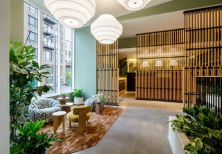 Seating space in lobby area with mail area in the background