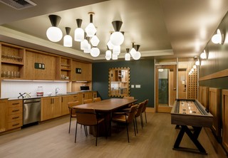 Game room with shuffleboard table and large meeting area