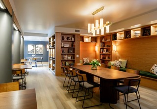 Library with large meeting table and smaller work areas
