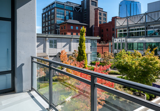 Apartment balcony looking out at The Louisa outdoor terrace