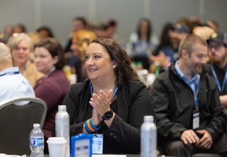 Woman smiling at conference table