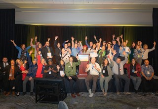 Group photo of professionals celebrating awards