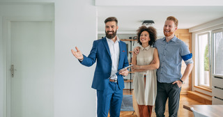 Man showing couple an apartment
