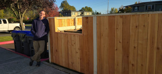 Sam Black in front of his newly-designed trash enclosure