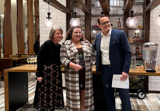 Sammie posing with Melody and Josh after being recognized