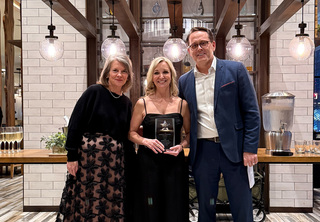 Michelle posing with Josh and Melody