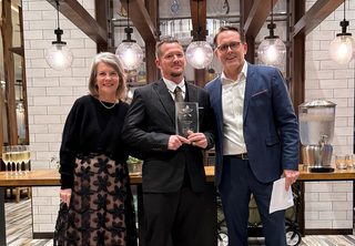 Steven posing with Josh and Melody