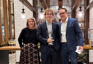 Samuel posing with Josh and Melody