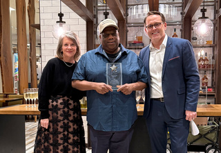 John posing with Josh & Melody