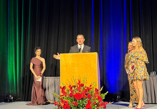 Steven accepting his award on stage